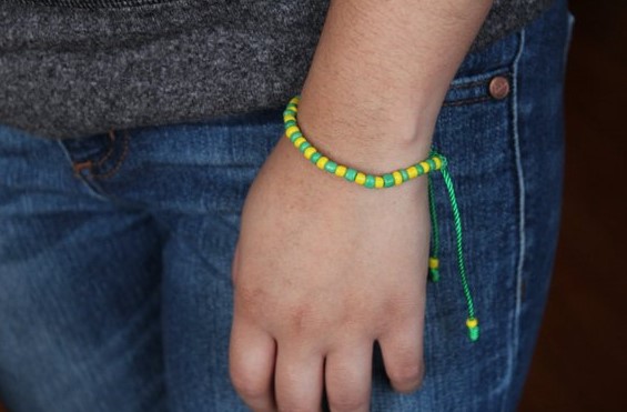 Which hand do Santeria bracelets go on